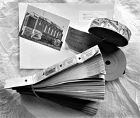 Black and white photo showing an image of the Adelphi cinema in Slough and some old style cinema tickets